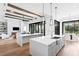 Spacious kitchen with a large island, high ceilings, and seamless connection to the living area at 1401 Brightwaters Ne Blvd, St Petersburg, FL 33704