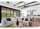 Spacious living area with sliding glass doors leading to the outdoor pool and entertaining area at 1401 Brightwaters Ne Blvd, St Petersburg, FL 33704