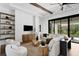 Cozy living room featuring neutral tones, wood accents, and ample natural light at 1401 Brightwaters Ne Blvd, St Petersburg, FL 33704
