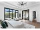 Spacious main bedroom with large windows, sitting area, and access to a private outdoor area at 1401 Brightwaters Ne Blvd, St Petersburg, FL 33704