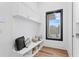 Functional mudroom featuring custom built-ins, storage benches, and stylish design at 1401 Brightwaters Ne Blvd, St Petersburg, FL 33704