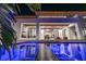 The gorgeous pool overlooks the outdoor living area and outdoor kitchen of this amazing home at 1401 Brightwaters Ne Blvd, St Petersburg, FL 33704