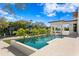 A stunning pool offers a luxurious outdoor living experience with lush landscaping at 1401 Brightwaters Ne Blvd, St Petersburg, FL 33704