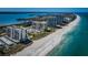 Stunning aerial view of beachfront condos along the shoreline with azure waters at 1460 Gulf Blvd # 506, Clearwater Beach, FL 33767