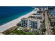 Stunning aerial view of beachfront condos with a pool, and direct beach access at 1460 Gulf Blvd # 506, Clearwater Beach, FL 33767