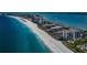 Breathtaking aerial view of the coastline, highlighting pristine beaches and luxurious beachfront residences at 1460 Gulf Blvd # 506, Clearwater Beach, FL 33767