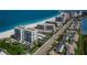 Scenic aerial shot of beachfront condos with beach access and palm tree landscaping at 1460 Gulf Blvd # 506, Clearwater Beach, FL 33767
