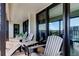 This condo has a balcony, perfect for entertaining, with chairs and views of the coastline at 1460 Gulf Blvd # 506, Clearwater Beach, FL 33767