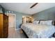 Comfortable bedroom featuring wood floors and a walk-in closet at 1460 Gulf Blvd # 506, Clearwater Beach, FL 33767