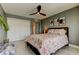 Relaxing bedroom with a large closet, modern artwork, and a comfy bed with seashell-themed linens at 1460 Gulf Blvd # 506, Clearwater Beach, FL 33767