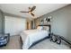 Cozy bedroom with a large ceiling fan, closet, and bench at 1460 Gulf Blvd # 506, Clearwater Beach, FL 33767