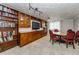 Inviting dining room with custom wood built-ins and a cozy round table at 1460 Gulf Blvd # 506, Clearwater Beach, FL 33767