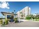 Gated entrance to South Beach community with lush landscaping and well-maintained grounds at 1460 Gulf Blvd # 506, Clearwater Beach, FL 33767