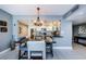 Eat-in kitchen featuring stainless appliances, granite counters, mosaic backsplash, and breakfast bar at 1460 Gulf Blvd # 506, Clearwater Beach, FL 33767