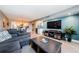 Open living room next to kitchen bar with modern decor and comfortable seating area at 1460 Gulf Blvd # 506, Clearwater Beach, FL 33767