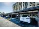 Covered parking area with designated spaces for residents, offering convenience at 1460 Gulf Blvd # 506, Clearwater Beach, FL 33767