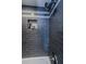 Modern shower with updated tile, large shower head, and built-in storage niche at 1460 Gulf Blvd # 506, Clearwater Beach, FL 33767