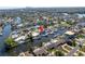 An aerial view showcasing a waterfront home and dock with canal access, minutes from downtown. Red arrow indicating subject property at 1467 52Nd Ne Ave, St Petersburg, FL 33703