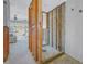 Bathroom featuring exposed wall studs with open access to adjacent rooms and natural light at 1467 52Nd Ne Ave, St Petersburg, FL 33703