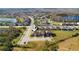 Aerial perspective of a home in a neighborhood near a lake, offering a picturesque setting at 1593 Secluded Garden Ln, Lutz, FL 33558