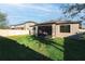 Spacious backyard with screened in lanai and room for entertaining and recreation at 1593 Secluded Garden Ln, Lutz, FL 33558