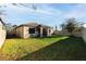 Large backyard with screened-in lanai and room for entertaining and recreation at 1593 Secluded Garden Ln, Lutz, FL 33558