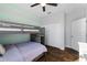 Bedroom featuring a bunk bed, wood-look tile flooring, and closet at 1593 Secluded Garden Ln, Lutz, FL 33558