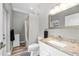 Bathroom with a granite countertop, modern fixtures, and neutral decor at 1708 Country Trails Dr, Safety Harbor, FL 34695