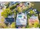 Aerial view of the home and property with a swimming pool and private dock at 1772 Indian Rocks S Rd, Largo, FL 33774