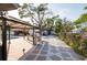 Spacious backyard featuring a gazebo, outdoor kitchen, pool, and stone paver patio at 1772 Indian Rocks S Rd, Largo, FL 33774