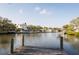 Scenic waterfront view from the backyard, featuring a private dock and tranquil canal access for boating and relaxation at 1772 Indian Rocks S Rd, Largo, FL 33774