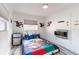 Fun bedroom with colorful themed bedspread, accent lighting, and decor at 1772 Indian Rocks S Rd, Largo, FL 33774