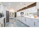 Modern kitchen featuring a large island, stainless steel appliances, and ample storage space at 1772 Indian Rocks S Rd, Largo, FL 33774