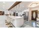 Stunning kitchen features a large island, stainless steel appliances, and modern pendant lighting at 1772 Indian Rocks S Rd, Largo, FL 33774