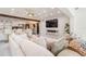Bright living room with modern lighting, open kitchen, and entertainment area at 1772 Indian Rocks S Rd, Largo, FL 33774