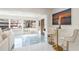 Bright living room with pool view, modern decor, and marble floors at 1772 Indian Rocks S Rd, Largo, FL 33774