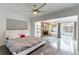 Spacious main bedroom featuring a cozy fireplace and access to the pool area at 1772 Indian Rocks S Rd, Largo, FL 33774
