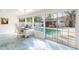 Bright office space with a pool view through the large windows at 1772 Indian Rocks S Rd, Largo, FL 33774