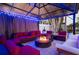 Cozy outdoor living space features a fire pit, comfortable seating, and ambient lighting at 1772 Indian Rocks S Rd, Largo, FL 33774