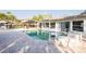 Backyard swimming pool with modern waterfall feature and outdoor living space at 1772 Indian Rocks S Rd, Largo, FL 33774