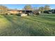 Expansive backyard featuring a charming patio area perfect for outdoor gatherings and relaxation at 18401 Hamilton Rd, Dade City, FL 33523