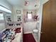 Bathroom with a vintage pink tile design and walk-in tub at 18401 Hamilton Rd, Dade City, FL 33523