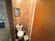 Powder room with floral wallpaper and black and white checkerboard floor at 18401 Hamilton Rd, Dade City, FL 33523