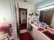 Vintage style bathroom showcasing dual sinks and pink and white tiles at 18401 Hamilton Rd, Dade City, FL 33523