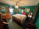 Cozy bedroom features a comfortable bed and vintage furnishings; ready for a peaceful night's rest at 18401 Hamilton Rd, Dade City, FL 33523