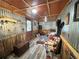 Unique living room with corrugated metal walls, rustic decor, and cozy seating, creating a distinctive and welcoming atmosphere at 18401 Hamilton Rd, Dade City, FL 33523