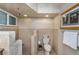 Updated bathroom featuring tiled walls, a walk-in shower and modern fixtures at 210 Dolphin Pt # B, Clearwater Beach, FL 33767