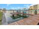 Private boat dock featuring a boat lift and comfortable seating for enjoying the waterfront at 210 Dolphin Pt # B, Clearwater Beach, FL 33767