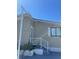 Close up view of the entrance steps with white metal safety railing to the front door at 228 N Saint George Cir, Apollo Beach, FL 33572