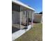 Enclosed porch with outdoor space and views of the yard and property at 228 N Saint George Cir, Apollo Beach, FL 33572